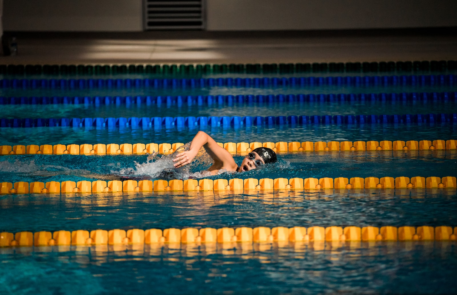person diving in pool